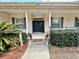 Charming entryway featuring a double door, neat landscaping, and warm, welcoming accents at 5261 Waterwood Dr, Bartow, FL 33830
