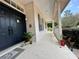 Inviting front porch features double doors, fresh paint, and a welcoming atmosphere at 5261 Waterwood Dr, Bartow, FL 33830