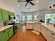 Bright and airy kitchen with stainless steel appliances, green cabinets and an eat-in dining nook at 5261 Waterwood Dr, Bartow, FL 33830