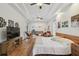 Generous main bedroom featuring a tray ceiling, hardwood floors, and serene atmosphere at 5261 Waterwood Dr, Bartow, FL 33830