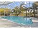 Gorgeous pool area enclosed with screen, perfect for relaxation and entertaining at 5261 Waterwood Dr, Bartow, FL 33830