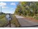 Walking path surrounded by greenery on a bright day, encouraging outdoor activities at 5261 Waterwood Dr, Bartow, FL 33830