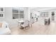 Bright dining room with modern table, chairs, stainless steel appliances, and a kitchen island at 1324 Painted Bunting Ave, Oakland, FL 34787