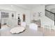 Open-concept dining area flowing into a modern kitchen, featuring stainless steel appliances and ample counter space at 1324 Painted Bunting Ave, Oakland, FL 34787