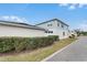 Two-story home with blue siding, neatly trimmed hedges, and a well-maintained lawn at 1324 Painted Bunting Ave, Oakland, FL 34787