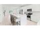 Wide angle view of the kitchen island looking to the living room area showcasing an open floorplan layout at 1324 Painted Bunting Ave, Winter Garden, FL 34787