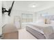 Serene main bedroom featuring a plush bed, dresser, and ample natural light at 1324 Painted Bunting Ave, Winter Garden, FL 34787