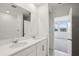 Modern bathroom with double vanity, chrome faucets and fixtures, and white cabinetry at 2530 Linda Knoll Ln, Bartow, FL 33830