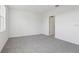 A gray carpeted bedroom with white walls and one window at 2530 Linda Knoll Ln, Bartow, FL 33830