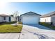 This is the front exterior of this single Gathering home featuring a two-car garage and a drought tolerant yard at 2530 Linda Knoll Ln, Bartow, FL 33830