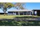 Charming home with a metal roof and a quaint porch at 3254 E Canal Ln, Fort Meade, FL 33841