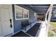 Inviting front porch with a bench and classic details at 3254 E Canal Ln, Fort Meade, FL 33841