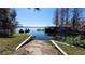 Scenic lake view featuring a boat ramp, clear skies, and boats out on the water at 3254 E Canal Ln, Fort Meade, FL 33841