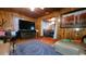 Warm living room featuring wood paneling and cozy furnishings at 3254 E Canal Ln, Fort Meade, FL 33841