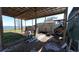 Covered storage area with ladders and equipment at 3254 E Canal Ln, Fort Meade, FL 33841