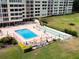 A high angle shot of a community pool with shuffleboard near the residential building at 700 Mirror Nw Ter # 505, Winter Haven, FL 33881