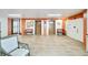 Hallway with tile floors, elevator access, benches, and art showcasing the building's features at 700 Mirror Nw Ter # 505, Winter Haven, FL 33881