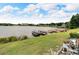 Beautiful waterfront view with boat docks, lush lawn, and serene lake setting with boats at 700 Mirror Nw Ter # 505, Winter Haven, FL 33881