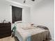 The bedroom features a bed, crib, and modern wood-look flooring at 1741 Hill Top Dr, Dundee, FL 33838