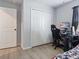 Bedroom with a gaming setup, closet, and wood-look flooring at 1741 Hill Top Dr, Dundee, FL 33838