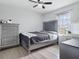 Bedroom featuring a vanity with lighted mirror and a sleek gray dresser at 1741 Hill Top Dr, Dundee, FL 33838