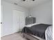 This bedroom features a closet with white doors and modern dresser at 1741 Hill Top Dr, Dundee, FL 33838