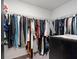 Walk-in closet with ample storage space, featuring rods and shelving for organizing clothes and accessories at 1741 Hill Top Dr, Dundee, FL 33838