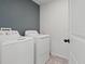 Neat laundry room with a modern washer and dryer set at 1741 Hill Top Dr, Dundee, FL 33838