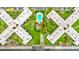 Drone view of a condo complex featuring a swimming pool, manicured grounds, and X shaped buildings at 333 Lake Howard Dr Nw # 314D, Winter Haven, FL 33880