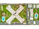 Aerial view of condo complex with neatly manicured green spaces between buildings and parking at 333 Lake Howard Dr Nw # 314D, Winter Haven, FL 33880