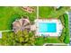 Bird's eye view of the community pool with covered lounge area and landscaping at 333 Lake Howard Dr Nw # 314D, Winter Haven, FL 33880