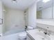 Cozy bathroom features a tub and shower combination with decorative tile and bright lighting at 333 Lake Howard Dr Nw # 314D, Winter Haven, FL 33880