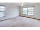 Bright bedroom with multiple windows and plush carpeting at 333 Lake Howard Dr Nw # 314D, Winter Haven, FL 33880