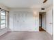 Bright bedroom features neutral carpet, double door closet, and a window at 333 Lake Howard Dr Nw # 314D, Winter Haven, FL 33880