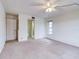 Bedroom featuring neutral walls and carpet flooring at 333 Lake Howard Dr Nw # 314D, Winter Haven, FL 33880