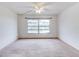 Bright bedroom with a large window and neutral carpet at 333 Lake Howard Dr Nw # 314D, Winter Haven, FL 33880