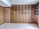 Bedroom featuring paneled walls with a shelf and carpet flooring at 333 Lake Howard Dr Nw # 314D, Winter Haven, FL 33880