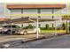 Exterior shot of a condo building with covered parking and well-maintained landscaping at 333 Lake Howard Dr Nw # 314D, Winter Haven, FL 33880