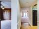 Open living room showcasing neutral tones, ceiling fan, and transitions to the kitchen and a secondary bedroom at 333 Lake Howard Dr Nw # 314D, Winter Haven, FL 33880