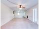 Spacious living room with neutral carpet and white walls, ready for personalization at 333 Lake Howard Dr Nw # 314D, Winter Haven, FL 33880