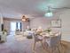 Bright living room with neutral colors, modern furnishings, and dining space at 333 Lake Howard Dr Nw # 314D, Winter Haven, FL 33880