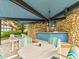 Outdoor recreation area with shaded seating and stone accents at 333 Lake Howard Dr Nw # 314D, Winter Haven, FL 33880