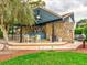 Outdoor recreation area with stone accents, comfortable seating, and a grill at 333 Lake Howard Dr Nw # 314D, Winter Haven, FL 33880