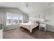 Bright bedroom with a large window, vaulted ceilings, and neutral decor creating a serene atmosphere at 3798 Plainview Dr, Orlando, FL 32824
