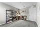Cozy bedroom with gray carpet, shelving, a desk setup, and plenty of natural light at 3798 Plainview Dr, Orlando, FL 32824