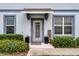 Welcoming front entrance with decorative plants, and stylish door at 3798 Plainview Dr, Orlando, FL 32824