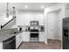 Contemporary kitchen with granite countertops and modern appliances at 3798 Plainview Dr, Orlando, FL 32824