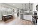 Bright kitchen boasts stainless steel appliances, granite countertops, and dining area with natural light at 3798 Plainview Dr, Orlando, FL 32824