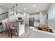 Well-lit kitchen featuring stainless steel appliances and bar stool seating at 3798 Plainview Dr, Orlando, FL 32824