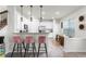 Modern kitchen with sleek white cabinets and bar stool seating at 3798 Plainview Dr, Orlando, FL 32824